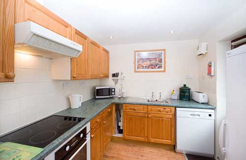 Bramblewood's kitchen with dishwasher, freezer, ceramic hob and oven